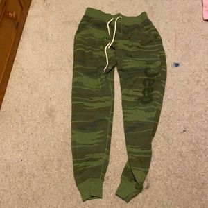 Green sweatpants fuzzy on inside and says jeep